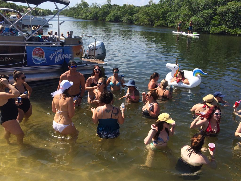 6bcd80c3-75a9-4914-b0d5-3249c5ed081f a group of people swimming in a body of water