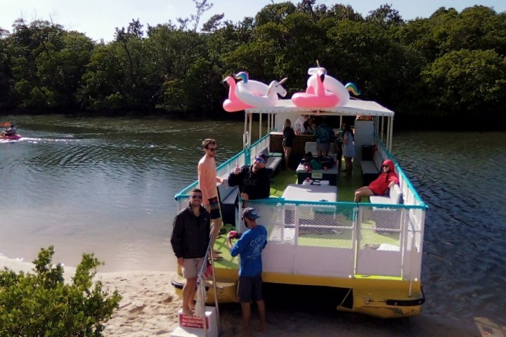 a group of people on a boat in the water