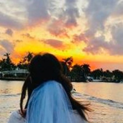 a person standing in front of a body of water