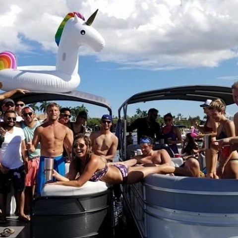a group of people on a boat in the water