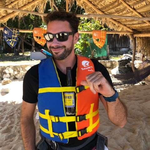 a man wearing sunglasses taking a selfie