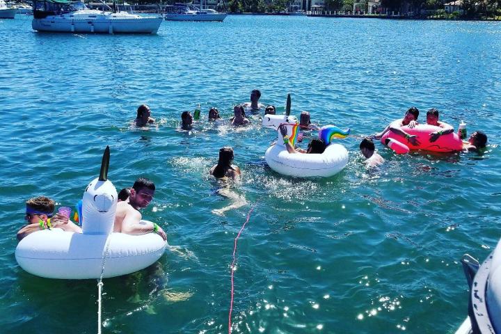 a group of people on a boat in the water