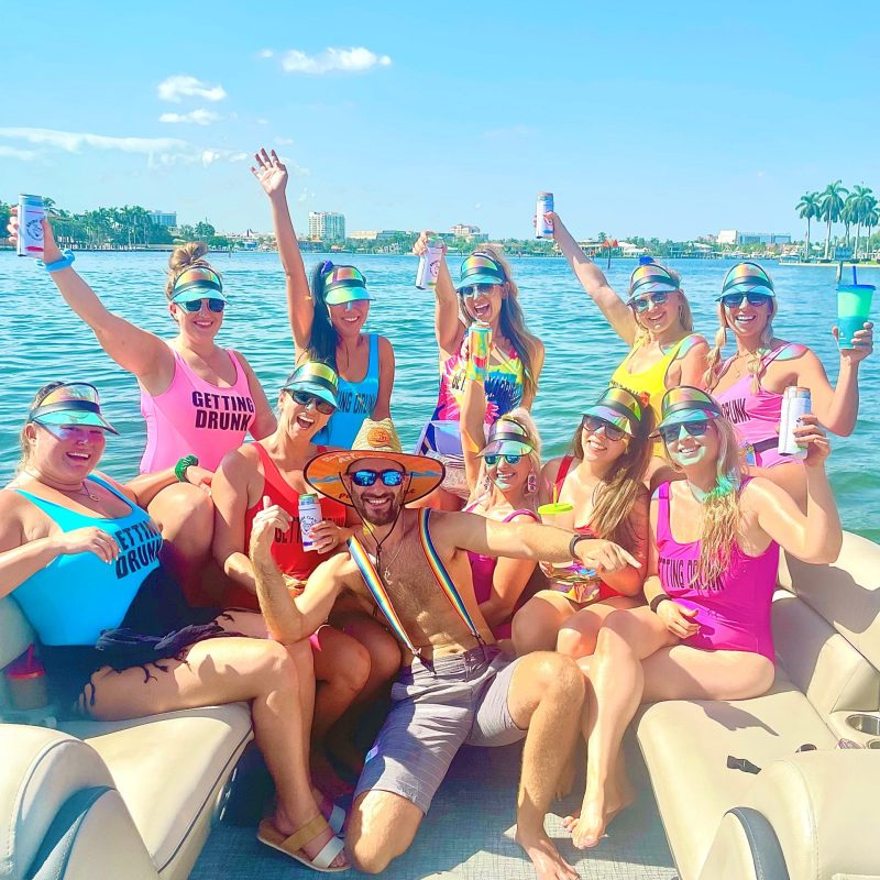 a group of people sitting at a beach