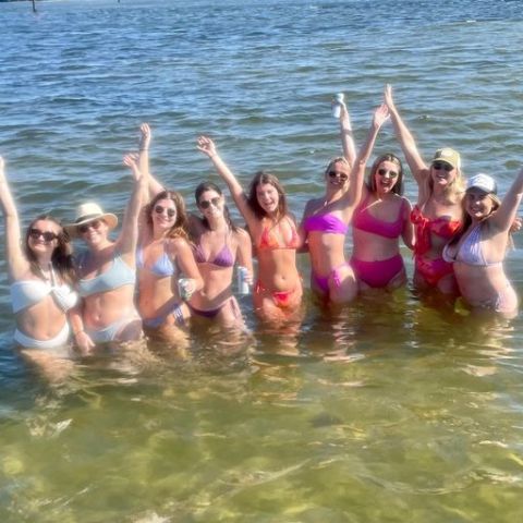 a group of people swimming in a body of water