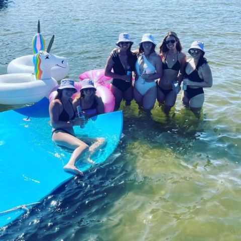 a group of people swimming in a body of water