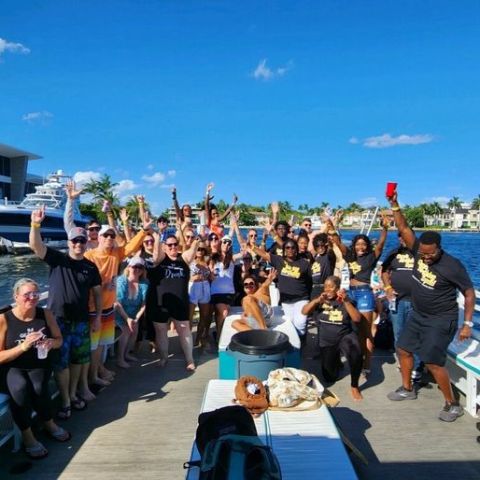 a group of people walking in front of a crowd