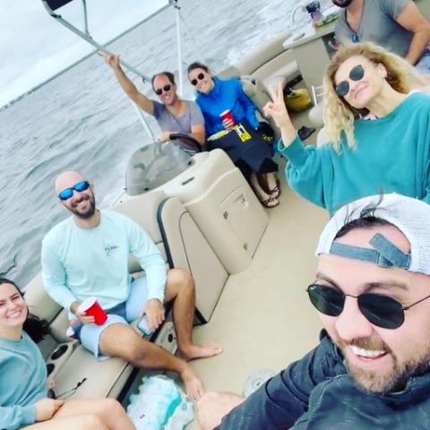 a group of people sitting posing for the camera